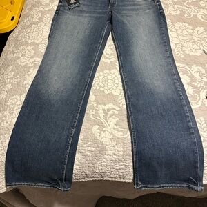 Women's Silver Suki Slim Boot Blue Jeans. New. Never worn. Dark wash.